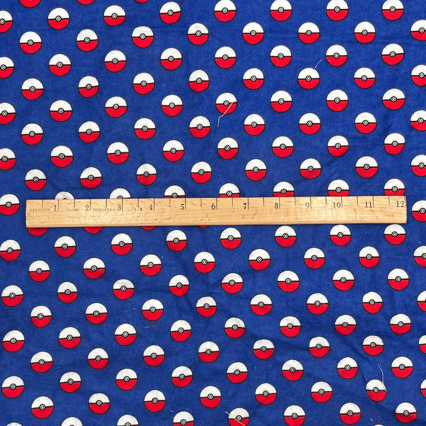 1 1/3 Yard Robert Kaufman Poké Ball Print Flannel, Cotton